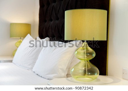 Luxurious modern bed design and bedside lamps