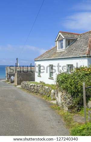 houses by the sea on the cornish coast cornwall, england uk