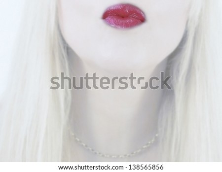 woman blowing kiss with red lipstick