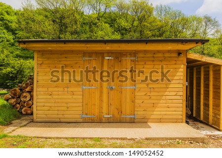 a new wooden shed in the countryside