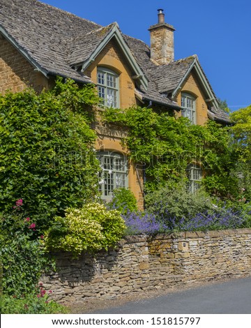 a country cottage with a garden in the oxfordshire cotswolds village of adlestrop, made famous by the poem - I remember Adlestrop
