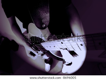 14 year old teenage boy playing punk rock on a vintage blonde fender telecaster type guitar in rehearsal room on performing arts course