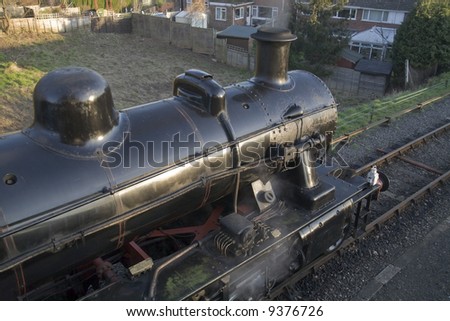 Close up of the boiler and chimney on an old steam locomotive.