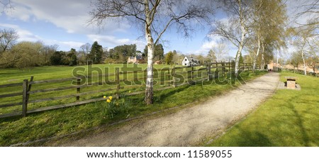 Farmland field with sheep and houses warwickshire england uk