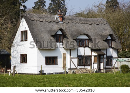 thatched cottage in an english village