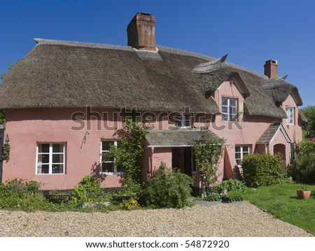 thatched cottage in an english village