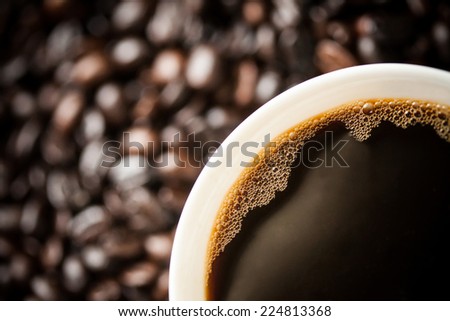 White cup on the coffee beans