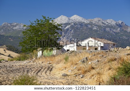 Spanish old villa with mountains on background