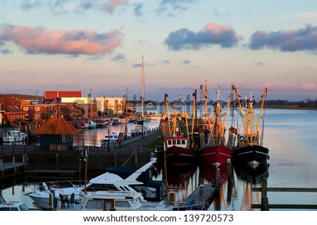 fishing ships in harbor before sunset, Zoutkamp, Netherlands