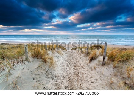 sand path to North sea coast at sunset, North Holland, Netherlands