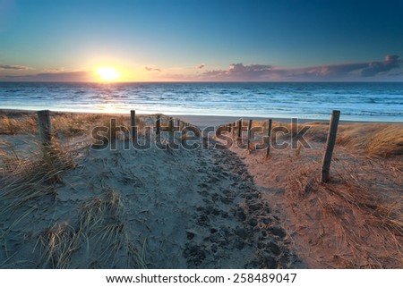sand path no North sea beach at sunset, Netherlands