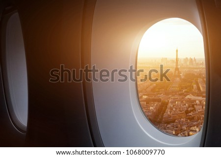 travel to Paris, view of Eiffel Tower from the window of airplane, holidays in France, Europe