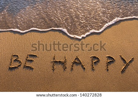 be happy, words written on the beach