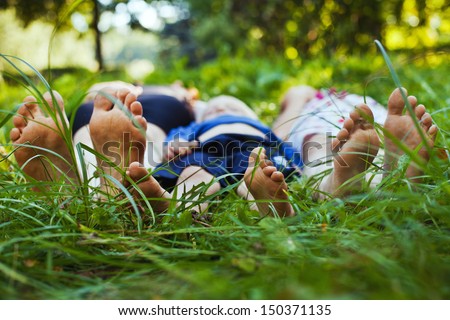 Family Relaxing On The Grass