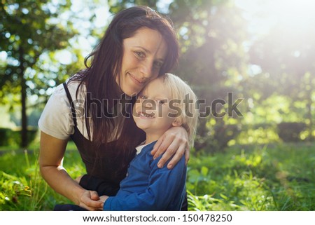 family portrait with place for the text, young beautiful mother with cute child