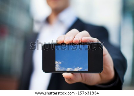 smart phone in the hand of businessman