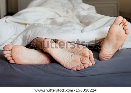 Lover\'S Feet In The Bed