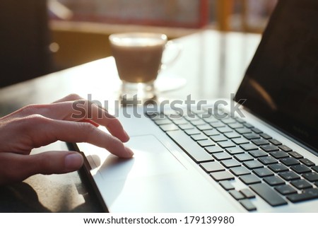 using computer, check e-mail in the morning