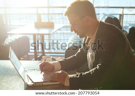 business man working with documents and laptop