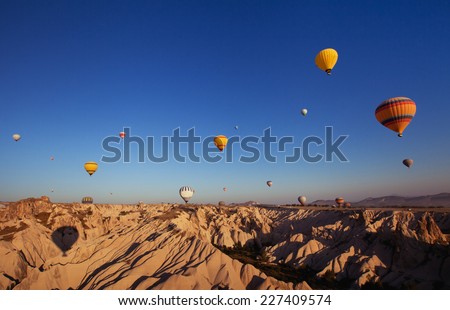 beautiful landscape with hot air balloons and mountains in Cappadocia, Turkey