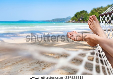 relaxing in hammock on the beautiful paradise beach