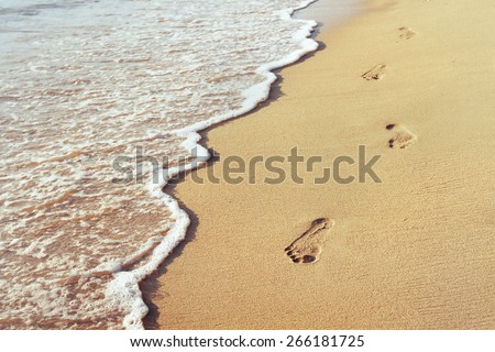 way to new life, wellbeing concept, Footprints in the sand