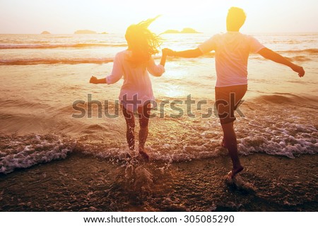 happy couple on the beach, summer vacations or honeymoon
