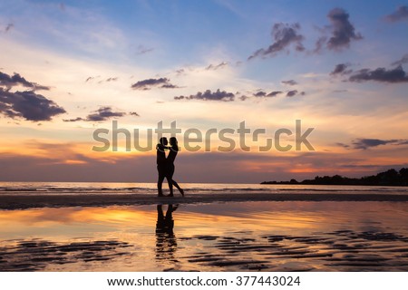 silhouette of couple on sunset beach, beautiful background about love and relationships, man and woman