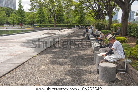 TOKYO,JAPAN-JULY 5:Unidentified people painting in the park of the Imperial Palace on the July 5,2011 in Tokyo,Japan.The Imperial Palace is only accessible by guided tour only in Japanese.