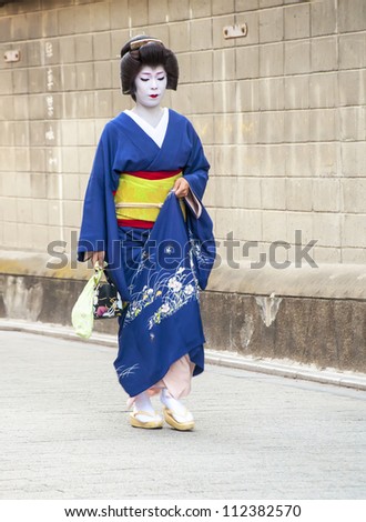 KYOTO,JAPAN, JULY 16: Unidentified geisha walks on the Gion district on July 16, 2011 in Kyoto, Japan. In the 1920 had some 80,000 geisha in Japan, but today there are approximately 1,000.