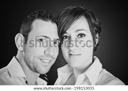 Young couple in love on black and white