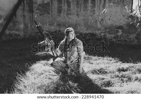 Spanish military girl with his machine gun. Photographs in black and white