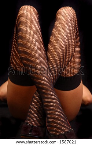 Crossed legs | young woman wearing net stockings