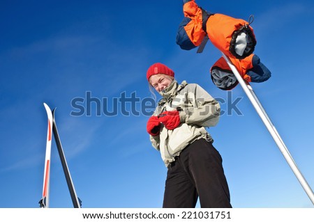 A woman skiing in the mountains, outdoor shoot.