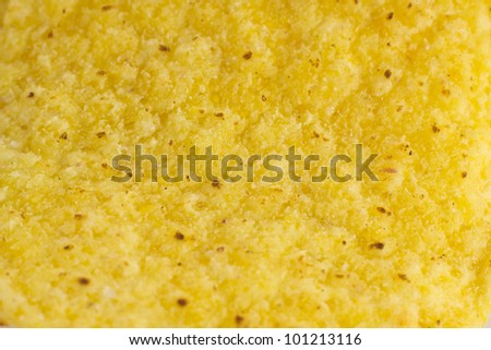 A closeup picture of a nacho chips