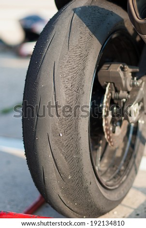 Worn tire on a motorcycle.