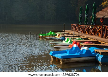 Trakoscan, Croatia - November 2, 2014: Colorful docked pedal boats on a lake near castle Trakoscan, Croatia.