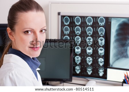 Female doctor in diagnostic center with mri scan