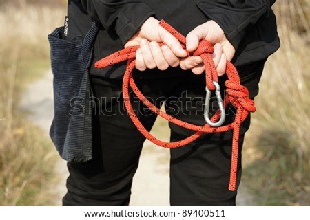 Leash with snap-hook behind back