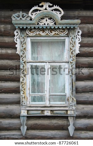 window of an old Russian house with decorative carvings