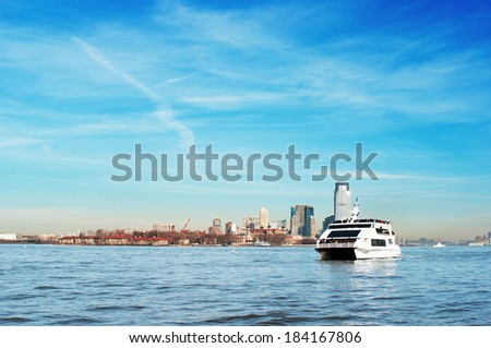 Luxury yacht transporting passengers on Hudson river New York