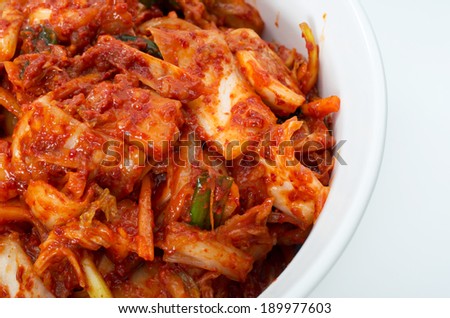 Korean cuisine, fermented food Kimchi on white ceramic bowl