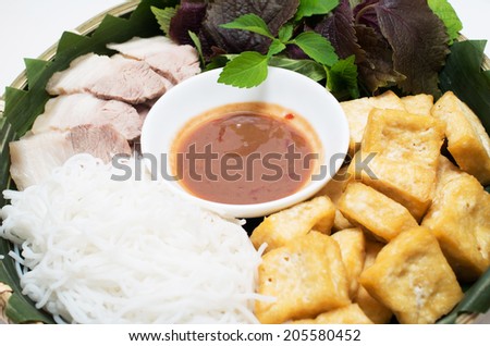 Vietnamese traditional plate pork vermicelli  tofu and vegetable in bamboo plate