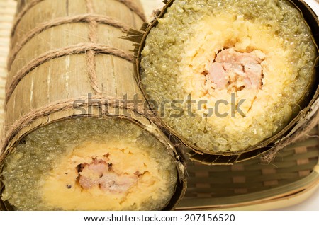 Vietnamese sticky rice cake wrapped in banana leaves , banh tet