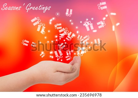 Seasons greetings card with hand open on red background