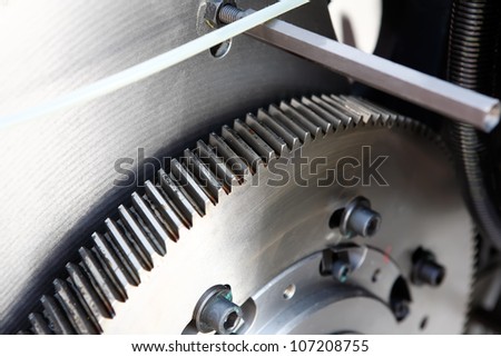 Machine steel gear wheel. Industrial gear detail. Mechanic concept background.