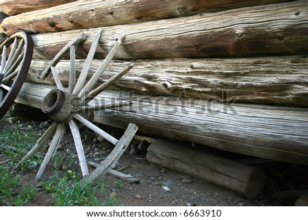 Broken wagon wheel in ghost town