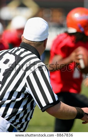 FOOTBALL REFEREE WATCHING THE PLAY