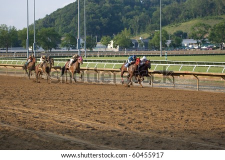 CHESTER, WEST VIRGINIA - JUNE 14: Race horses head down the stretch at The Mountaineer Racetrack on June 14, 2010 in Chester West Virginia.