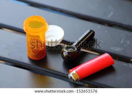 Everything you need for medicinal marijuana including a lighter, pipe, and medicinal marijuana